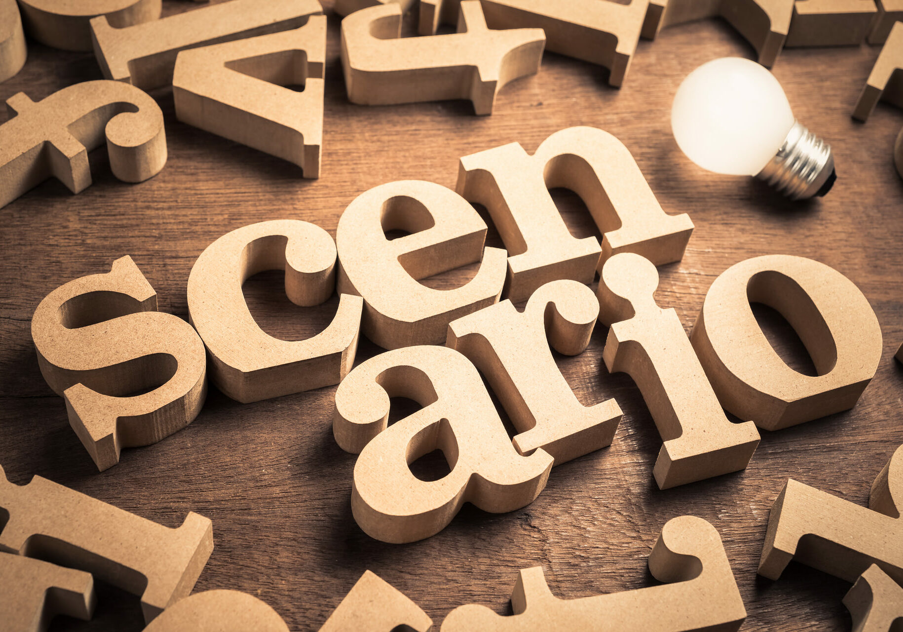Scenario word in scattered English alpabets with glowing light bulb