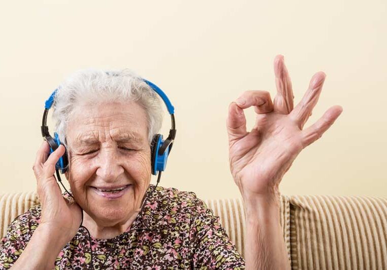 aged-care-music Elderly women listening to music smiling